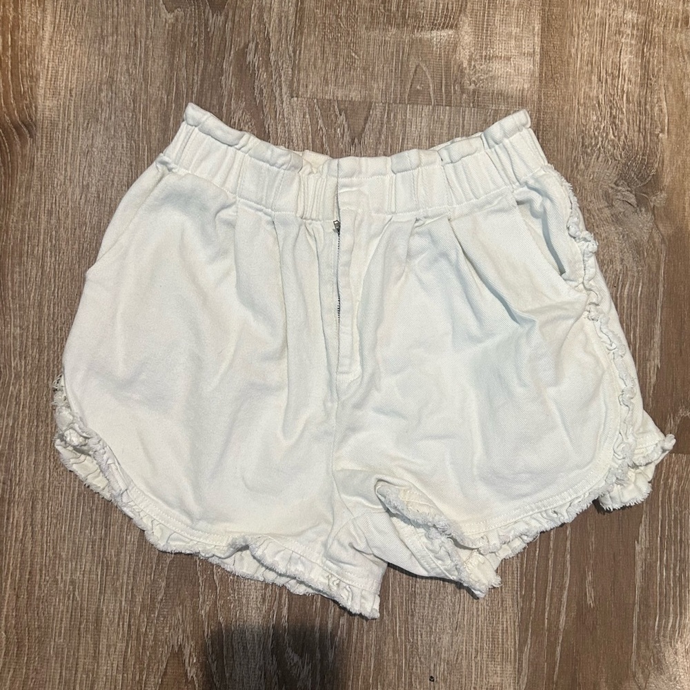 White fringe jean shorts